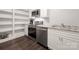 Bright kitchenette with white cabinets, stainless steel appliances, and granite countertops at 1506 Venetian Way Dr, Waxhaw, NC 28173