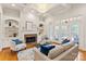 Cozy living room with fireplace, built-ins, hardwood floors, and access to the backyard at 1506 Venetian Way Dr, Waxhaw, NC 28173