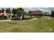 Community playground with slides, swings, and covered picnic area at 1506 Venetian Way Dr, Waxhaw, NC 28173