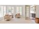 Bright sitting room with neutral tones, hardwood floors, plantation shutters, and natural light at 1506 Venetian Way Dr, Waxhaw, NC 28173