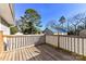Wooden back deck overlooking backyard and neighboring home at 1511 Liberty Ave, Albemarle, NC 28001