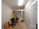 Spacious basement area with shelving, offering ample storage and potential for customization at 1511 Liberty Ave, Albemarle, NC 28001