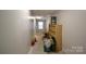 Bright unfinished basement space with natural light, shelving, and potential for customization at 1511 Liberty Ave, Albemarle, NC 28001