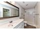 Bathroom features a vanity with marble countertop and walk-in shower at 1511 Liberty Ave, Albemarle, NC 28001