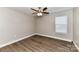Bedroom boasts wood-look floors, natural light, and neutral wall color at 1511 Liberty Ave, Albemarle, NC 28001