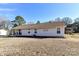 Lovely home with a well-kept lawn, complemented by a comfortable porch and manicured flowerbeds at 1511 Liberty Ave, Albemarle, NC 28001