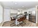 Bright kitchen features granite counters, stainless steel appliances, wood floors, and a center island with seating at 1511 Liberty Ave, Albemarle, NC 28001
