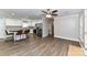 Open floor plan with hardwood floors, connecting living room and kitchen with island seating at 1511 Liberty Ave, Albemarle, NC 28001