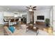 Bright open-concept living room flows into kitchen with island, stainless appliances, and modern finishes at 1511 Liberty Ave, Albemarle, NC 28001