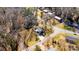 Aerial view of home with a metal roof, driveway, and a yard outlined in yellow at 1552 10Th Street Nw Pl, Hickory, NC 28601