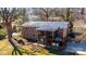Brick home featuring a screened porch and wooden deck overlooking the fenced backyard, perfect for entertaining at 1552 10Th Street Nw Pl, Hickory, NC 28601