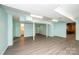Spacious finished basement with light blue walls and modern vinyl plank flooring at 1552 10Th Street Nw Pl, Hickory, NC 28601