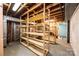 Unfinished basement area with built-in shelving and open storage space at 1552 10Th Street Nw Pl, Hickory, NC 28601