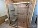 Large walk-in shower featuring glass doors, tile surround, and a convenient built-in seat at 1552 10Th Street Nw Pl, Hickory, NC 28601
