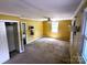 Spacious bedroom with a ceiling fan, closet, and an mounted television, offering comfort and convenience at 1552 10Th Street Nw Pl, Hickory, NC 28601