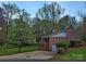 Charming brick home with a deck, mature trees, and a spacious driveway at 1552 10Th Street Nw Pl, Hickory, NC 28601