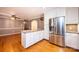 Open kitchen features stainless steel refrigerator, granite countertops, and ample counter space at 1552 10Th Street Nw Pl, Hickory, NC 28601