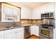Bright kitchen featuring stainless steel appliances, granite countertops, and tiled backsplash at 1552 10Th Street Nw Pl, Hickory, NC 28601
