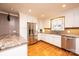 Updated kitchen featuring stainless steel appliances, granite countertops, and white cabinets at 1552 10Th Street Nw Pl, Hickory, NC 28601