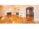 Open living room with hardwood floors, fireplace, and custom built-ins offers ample space for relaxing at 1552 10Th Street Nw Pl, Hickory, NC 28601