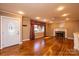 Hardwood floored living room with neutral colored walls, with a fireplace at 1552 10Th Street Nw Pl, Hickory, NC 28601