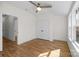Bedroom features a ceiling fan, hardwood floors, and a closet, providing ample storage space at 1824 Haines St, Charlotte, NC 28216