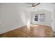 Bright bedroom features a ceiling fan, hardwood floors and two windows for ample natural light at 1824 Haines St, Charlotte, NC 28216