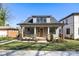 Charming home featuring a cozy front porch and well-manicured lawn at 1824 Haines St, Charlotte, NC 28216