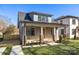 Charming home featuring a cozy front porch and well-manicured lawn at 1824 Haines St, Charlotte, NC 28216
