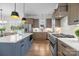 Gourmet kitchen with a large island, stainless appliances, and custom cabinetry at 1824 Haines St, Charlotte, NC 28216