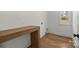 Laundry room features wood shelving, hardwood floors and a window for ample natural light at 1824 Haines St, Charlotte, NC 28216