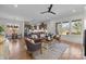 Open-concept living room featuring hardwood floors, neutral paint, and seamless flow into the kitchen and dining area at 1824 Haines St, Charlotte, NC 28216