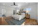 Beautifully decorated main bedroom features hardwood floors, a ceiling fan, and natural light at 1824 Haines St, Charlotte, NC 28216