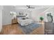 Beautifully decorated main bedroom features hardwood floors, a ceiling fan, and natural light at 1824 Haines St, Charlotte, NC 28216