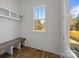 Welcoming mud room with built-in bench and storage, adjacent to the entry at 1824 Haines St, Charlotte, NC 28216