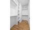 Well-organized walk-in closet with shelving and hanging space in a modern home at 1824 Haines St, Charlotte, NC 28216