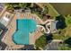 Aerial view showcases a sparkling pool, waterslides and an outdoor lounge area at 3009 Scottcrest Way, Waxhaw, NC 28173