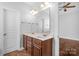 Bathroom features a double sink vanity and a large mirror at 3009 Scottcrest Way, Waxhaw, NC 28173