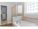 Bathroom featuring a glass shower and a large tub at 3009 Scottcrest Way, Waxhaw, NC 28173