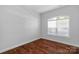 Bright bedroom featuring a window and hardwood floors at 3009 Scottcrest Way, Waxhaw, NC 28173
