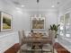 Dining room with modern chandelier, decorative molding, and neutral wall color at 3009 Scottcrest Way, Waxhaw, NC 28173