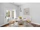 Cozy dining area with a round table, chairs, and natural light from French doors at 3009 Scottcrest Way, Waxhaw, NC 28173