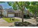 View of a home with neutral siding, brick accents, and a driveway leading to a garage at 3009 Scottcrest Way, Waxhaw, NC 28173