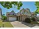 Charming two-story home featuring stone accents and a well-maintained front yard at 3009 Scottcrest Way, Waxhaw, NC 28173