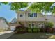 Charming two-story home featuring stone accents and a well-maintained front yard at 3009 Scottcrest Way, Waxhaw, NC 28173