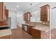 Open kitchen with stainless steel dishwasher, granite counters and wooden cabinets at 3009 Scottcrest Way, Waxhaw, NC 28173