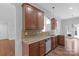 Spacious kitchen featuring wooden cabinets, granite counters and modern appliances at 3009 Scottcrest Way, Waxhaw, NC 28173