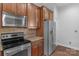 Well-equipped kitchen with stainless steel appliances, and wooden cabinets at 3009 Scottcrest Way, Waxhaw, NC 28173