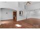 Open-concept living room featuring hardwood floors and views to kitchen at 3009 Scottcrest Way, Waxhaw, NC 28173