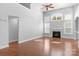 Open living space with hardwood floors, fireplace, large windows, and high ceilings at 3009 Scottcrest Way, Waxhaw, NC 28173